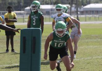 Suwannee quarterback/safety Kodi Lang performs a drill during Monday’s practice. (JAMIE WACHTER/Lake City Reporter)