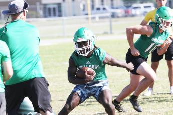 Suwannee running back Marquavious Owens rushes up the field during practice on May 1. (JAMIE WACHTER/Lake City Reporter)
