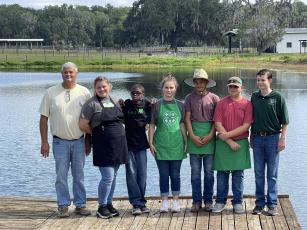 Lafayette County 4-H grillmasters that competed at the Regional Tailgate competition include County 4-H Agent Shawn Jackson (from left), Taylor Swinson, Jaxon Murphy, Alicia Swinson, Jayden Lumpkin, Justin Swinson Jr., and Holland Jackson. (COURTESY)