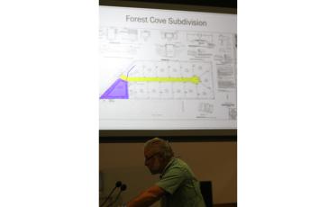 Assistant County Manager Kevin Kirby discusses the county’s design and maintenance manual for subdivisions Thursday as an example for how MSBUs would work using the Forest Cove subdivision is shown behind him. (JAMIE WACHTER/Lake City Reporter)