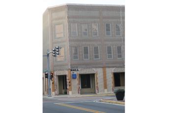 The Lake City Council will discuss the future of Lake City Hall at a workshop today. The current city hall has a safety net attached to it to prevent bricks from falling. (FILE)