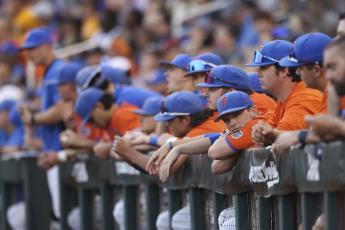 The Florida dugout watches in the seventh inning of Game 3 of the College World Series against LSU on Monday in Omaha, Neb.. (REBECCA S. GRATZ/Associated Press)