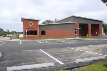 The parking lot at the Lake City Fire Station 2 was repaved last week after the original asphalt was ‘unraveling.’ The issue has delayed the station opening. (TONY BRITT/Lake City Reporter)