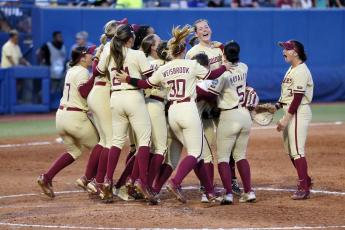 Florida State celebrates after defeating Tennessee in the Women’s College World Series semifinals on Monday in Oklahoma City. (NATE BILLINGS/Associated Press)