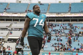 Jacksonville Jaguars offensive tackle Cam Robinson (74) walks off the field after a game against the Atlanta Falcons on Nov. 28, 2021, in Jacksonville. (GARY MCCULLOUGH/AP File)