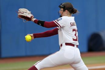 Florida State's Kathryn Sandercock pitches against Oklahoma State during the Women's College World Series on Thursday in Oklahoma City. (NATE BILLINGS/Associated Press)