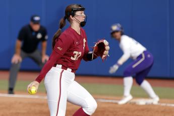 Florida State's Kathryn Sandercock pitches against Washington during the second inning of Saturday's Women's College World Series game in Oklahoma City. (NATE BILLINGS/Associated Press)