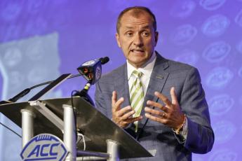 Atlantic Coast Conference Commissioner Jim Phillips answers a question at ACC Media Days on July 20, 2022, in Charlotte, N.C. (AP FILE)