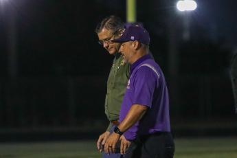 Columbia High Principal Trey Hosford talks with Columbia County Sheriff Mark Hunter at Tiger Stadium on Friday night after two armed teens climbed a fence attempting to get in. (BRENT KUYKENDALL/Lake City Reporter)