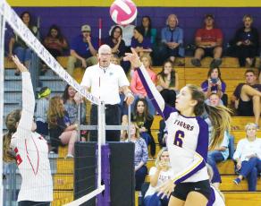 Columbia’s Sinei Wood hits a shot over the net against Fort White last season. (BRENT KUYKENDALL/Lake City Reporter)