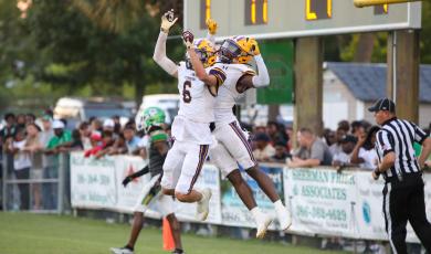 Columbia receivers Bynton Edge (left) and Zamarion Jones (right) celebrates after Jones caught a touchdown pass against Suwannee in last Friday’s Preseason Classic. (BRENT KUYKENDALL/Lake City Reporter)