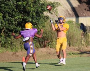 Columbia receiver Camdon Frier catches a touchdown pass during Monday’s practice. (JORDAN KROEGER/Lake City Reporter)