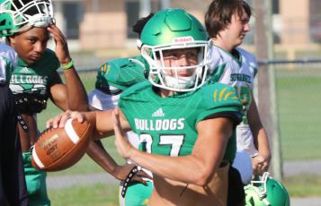 Suwannee quarterback Kodi Lang rolls out to throw a pass during Tuesday’s practice. (JAMIE WACHTER/Lake City Reporter)