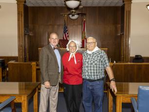 Lafayette County Judge Darren K. Jackson with Gloria and Allen Johnson after swearing the couple in as the 2022 Lafayette County Chamber of Commerce Pioneer Day Granny and Pappy last year at the Lafayette County Courthouse. Voting for this year’s Granny and Pappy begins today. (FILE)