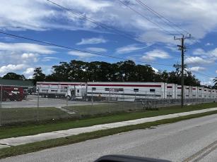 Trucks from Emergency Disaster Services line a parking lot at Suwannee High, which is serving as a mobile command center for the county’s emergency response. (JAMIE WACHTER/Lake City Reporter)