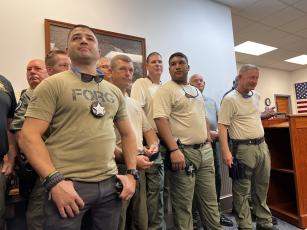 Members of the Santa Rosa County Sheriff’s Office are recognized Tuesday at the Lafayette County Commission meeting. (JAMIE WACHTER/Lake City Reporter)