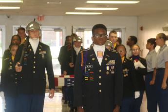 Titus Williams, the Columbia High JROTC Battalion Commander, leads the flag-bearing procession during Monday’s 9/11 memorial march at the school. (TONY BRITT/Lake City Reporter)