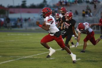 Lafayette quarterback Tywan Williamson races upfield during Friday’s 53-6 win over Hamilton County. (PAUL BUCHANAN/Special to the Reporter)