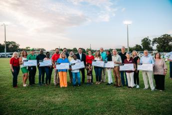 Gov. Ron DeSantis awarded $100,000 to to seven local education foundations Friday night prior to the Chiefland-Suwannee football game, including the Hamilton County Public Schools Foundation, the Lafayette Penny Foundation and the Suwannee Education Foundation. (COURTESY)