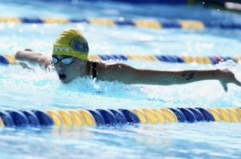 Columbia swimmer Casey Fair competes in the 100 butterfly at the District 2-3A meet on Oct. 23. (COURTESY)