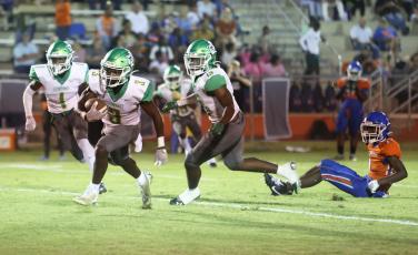 Suwannee defensive back Demontay Brown (3) returns an interception against Taylor County last Friday. (PAUL BUCHANAN/Special to the Reporter)