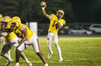 Columbia quarterback Xavier Collins throws a pass against Bolles on Friday. (BRENT KUYKENDALL/Lake City Reporter)