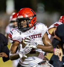 Lafayette linebacker Jalen Hill returns an interception for a touchdown against Trenton on Friday. (JACK HOWDESHELL/Special to the Reporter)