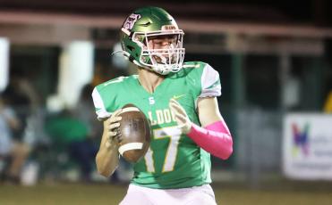 Suwannee quarterback Koy Frier drops back to pass against Wakulla on Friday. (PAUL BUCHANAN/Special to the Reporter)