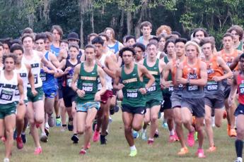 Suwannee runners Paul Gunter (middle left) and Morgan Mobley (middle right) take off at the Alligator Lake Invitational on Saturday. (COURTESY)