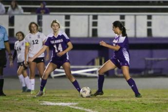Columbia's Carla Medina-Rodriguez (right) passes the ball to Mia Brasel (14) during a game against Middleburg last season. (FILE)
