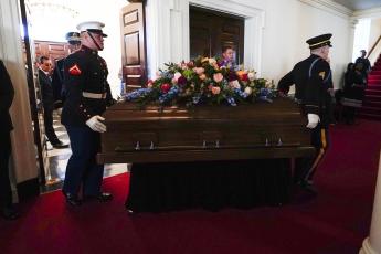 An Armed Forces body bearer team moves the casket for former first lady Rosalynn Carter into Glenn Memorial Church at Emory University for a tribute service on Tuesday in Atlanta. (BRYNN ANDERSON/Associated Press)