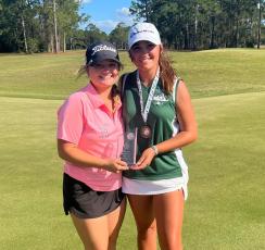 Suwannee High’s Ryan Donaldson (right), pictured with Columbia High’s Karlee Gainey at the district tournament, was added to the Class 2A state qualifiers list Friday after mistakenly being left off Thursday. (COURTESY)