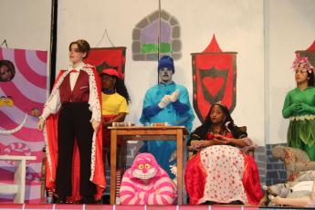 Connor Sanders (standing left), who is portraying the character of King of Hearts in Columbia High School’s production of Alice At Wonderland, rehearses a scene on Monday afternoon. (TONY BRITT/Lake City Reporter)