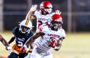 Lafayette’s Ja’marien Ervin returns an interception for a touchdown against Trenton on Oct. 20. (JACK HOWDESHELL/Special to the Reporter)
