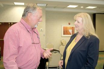 Konnie Patke talks with Carl King at a meet and greet on Nov. 1. Patke has accepted the job as Columbia County’s Tourist Development Council director. (FILE)