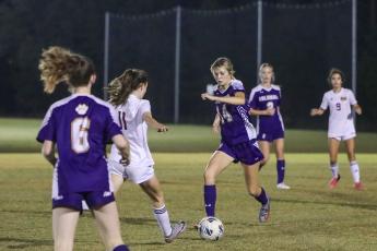 Columbia's Mia Brasel dribbles up the field against Florida High on Dec. 1. (BRENT KUYKENDALL/Lake City Reporter)