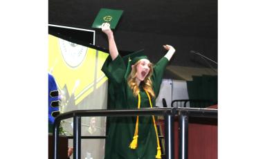 Zoey Isabellle Nettles shows her excitement after getting her college diploma Thursday night during the Florida Gateway College graduation ceremony. (TONY BRITT/Lake City Reporter)