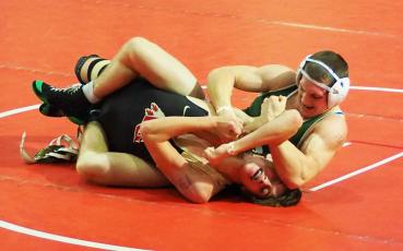 Suwannee’s Austin McKinney wrestles during the Knockout Christmas Classic over the weekend. (COURTESY)