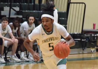 FGC guard Amayoa'ah Phillips dribbles up the court against Palm Beach State on Wednesday. (COURTESY OF FGC)