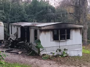 One person was sent to the hospital after a mobile home on NW Ridgewood Avenue caught fire Monday morning. (TONY BRITT/Lake City Reporter)