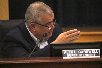 Lex Carswell, the superintendent of Columbia County Schools, aired frustrations at Tuesday night’s Columbia County School Board meeting with ‘negative’ comments about the district’s use of half-cent sales tax funds. (JAMIE WACHTER/Lake City Reporter)