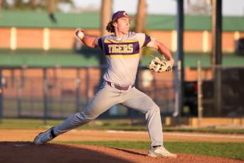 Columbia pitcher Ayden Phillips pitches against Suwannee on Thursday. (BRENT KUYKENDALL/Lake City Reporter)