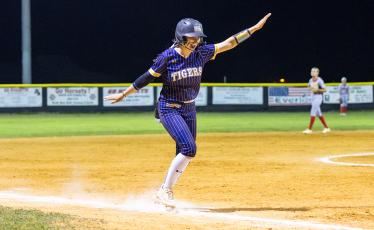 Columbia catcher Emily Delgado dances down the third base line as he head to ward home plate after hitting a 2-run home run during the Tigers’ 13-run fifth inning against Lafayette on Tuesday. (JACK HOWDESHELL/Special to the Reporter)