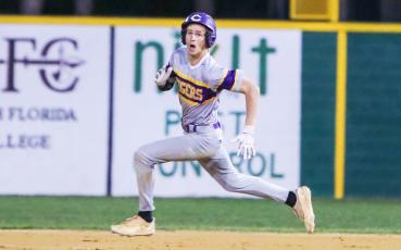 Columbia left fielder Bynton Edge runs to second base for a double against Suwannee on Thursday. (BRENT KUYKENDALL/Lake City Reporter)