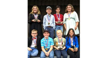 The eight finalists competing in the county speaking contest were, in back, Bristol Land (from left), Cooper Kirby, Miles Jackson and Sadie Byrd; in front, Trevor Mosley, Tatum Hart, Parker Gaskins and Reese Walker. (COURTESY)