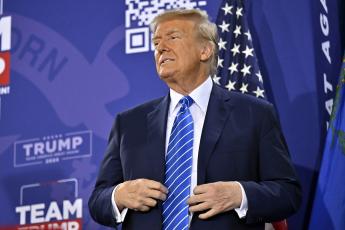 Republican presidential candidate and former U.S. President Donald Trump stands on stage during a campaign event at Big League Dreams Las Vegas on Jan. 27. (DAVID BECKER/Getty Images/TNS)