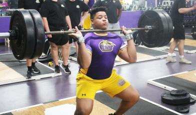 Columbia lifter Javon Bradley performs the clean and jerk during a tri-meet against Buchholz and Hamilton County on Feb. 28. (JORDAN KROEGER/Lake City Reporter)