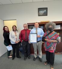 LCPD Community Relations Coordinator Ashley Hardison (from left), Sue Tuell, Assistant Police Chief Andy Miles, Chief Gerald Butler and Bernice D. Presley pose after Butler was presented with a Certificate of Appreciation. (COURTESY)