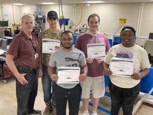 Four North Florida College students received certification from the college’s Industrial Machinery Maintenance 1 program. Pictured are, in front, Rashaun Alexander (from left) and TeKeya Jones; back row, instructor Bill Eustace (from left), Toby Woloszyn and Wyatt Liles. (COURTESY)