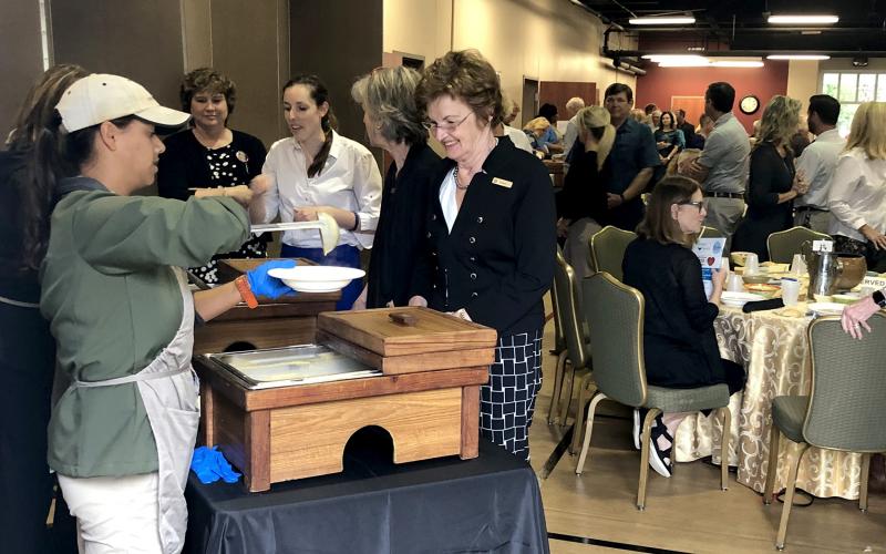 Attendees watch their bowls fill at the sixth annual Empty Bowls luncheon Nov. 8. The meal raised thousands of dollars for Barnabas Center’s programs that support Nassau County families in need. 